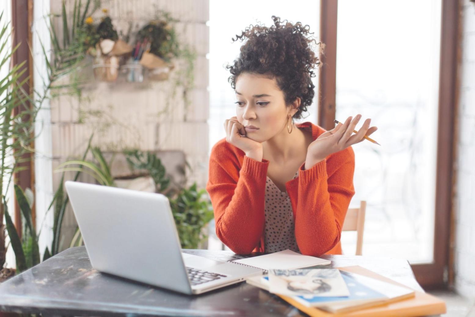 Professional workspace showing financial education materials and reference books